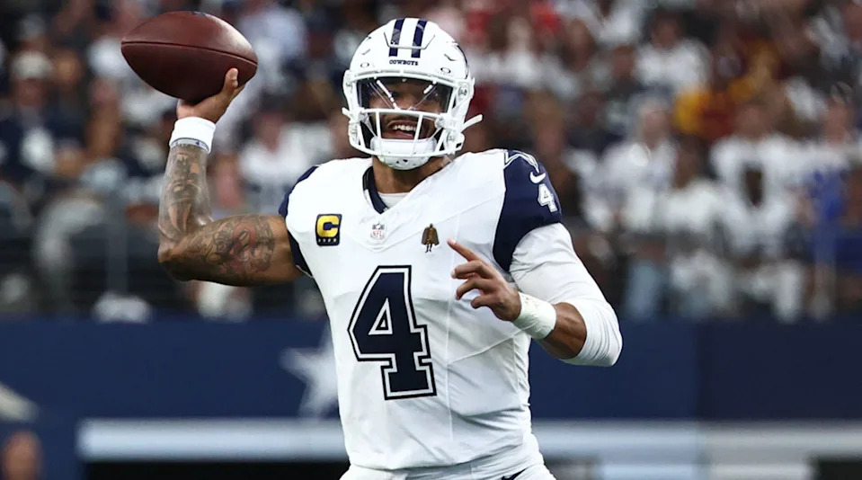 Dallas Cowboys quarterback Dak Prescott scrambles against the Washington CommandersKevin Jairaj-Imagn Images