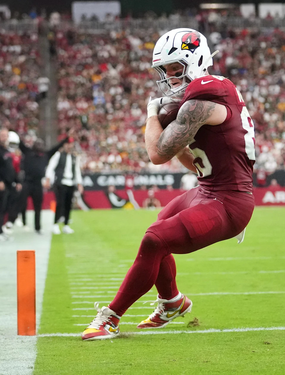 Arizona Cardinals tight end Trey McBride (85) scores a touchdown against the Green Bay Packers at State Farm Stadium in Glendale on Oct. 19, 2025.