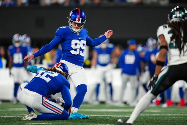 EAST RUTHERFORD, NJ - OCTOBER 09: Jude McAtamney #99 of the New York Giants kicks for a field goal during an NFL football game against the Philadelphia Eagles at MetLife Stadium on October 9, 2025 in East Rutherford, New Jersey. (Photo by Cooper Neill/Getty Images)