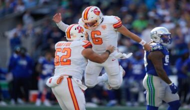Tampa Bay Buccaneers quarterback Baker Mayfield (6) celebrates with center Graham Barton (62) after a two-point conversion during the second half of an NFL football game against the Seattle Seahawks, Sunday, Oct. 5, 2025, in Seattle. (AP Photo/Stephen Brashear)