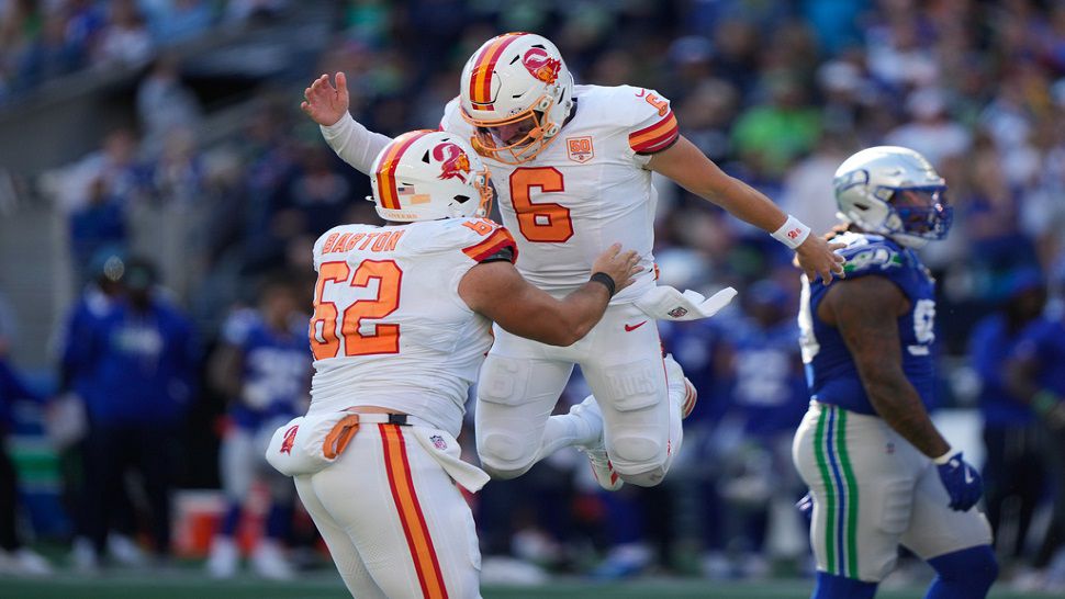 Tampa Bay Buccaneers quarterback Baker Mayfield (6) celebrates with center Graham Barton (62) after a two-point conversion during the second half of an NFL football game against the Seattle Seahawks, Sunday, Oct. 5, 2025, in Seattle. (AP Photo/Stephen Brashear)