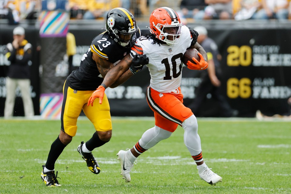 Quinshon Judkins runs through a tackle