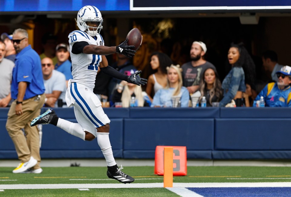 Adonai Mitchell #10 of the Indianapolis Colts fumbles the ball at the goal line during the third quarter against the Los Angeles Rams