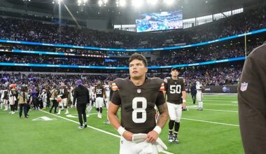 Dillon Gabriel walks off the field after losing on his full NFL debut for the Cleveland Browns