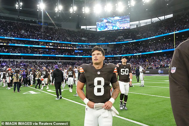 Dillon Gabriel walks off the field after losing on his full NFL debut for the Cleveland Browns