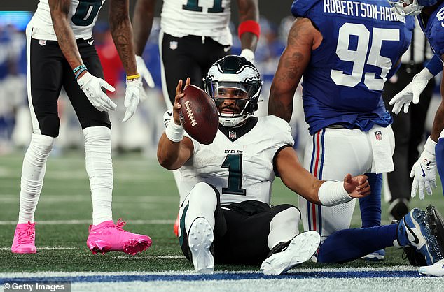 Hurts drops the football in the end zone after surviving another tush push from the 1-yard line