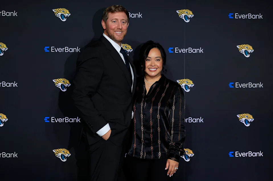 New Jacksonville Jaguars head coach Liam Coen poses for a photo with wife Ashley Coen after speaking and being introduced during a press conference Monday, Jan. 27, 2025 at the Miller Electric Center in Jacksonville, Fla. [Corey Perrine/Florida Times-Union]