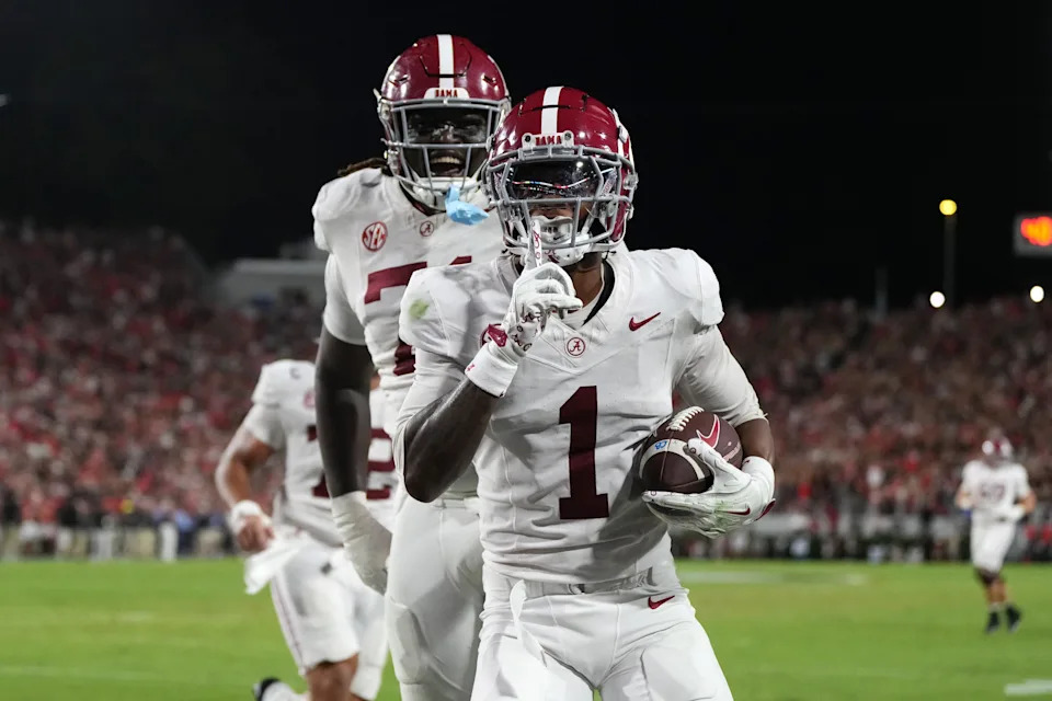 Sep 27, 2025; Athens, Georgia, USA; Alabama Crimson Tide wide receiver Isaiah Horton (1) celebrates with offensive lineman Kadyn Proctor (74) after scoring a touchdown against the Georgia Bulldogs in the second quarter at Sanford Stadium. Mandatory Credit: Dale Zanine-Imagn Images