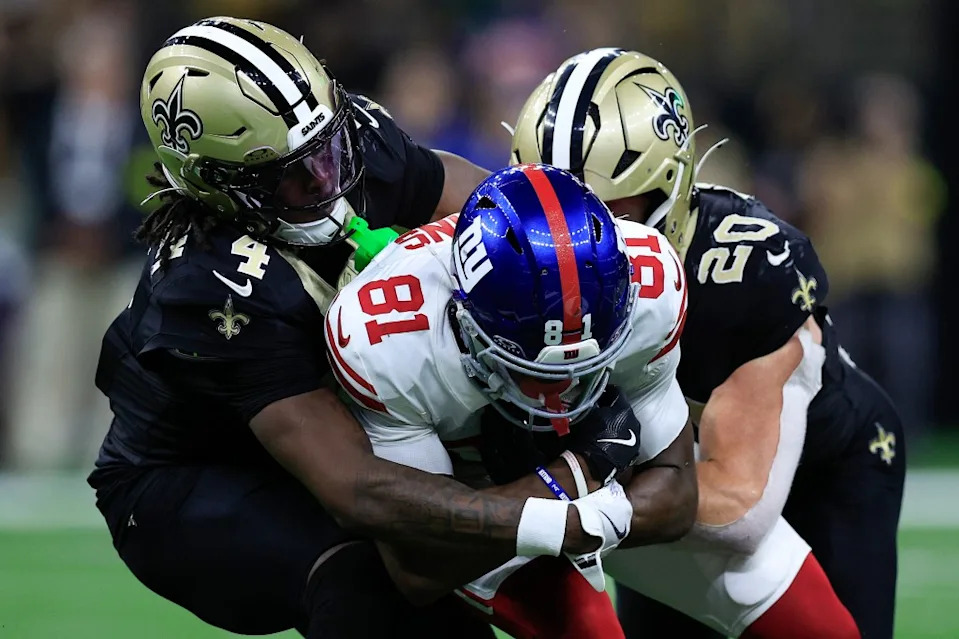 Beaux Collins is tackled in the game by Kool-Aid McKinstry (4) and Pete Werner (20) after making a catch during the Giants’ Week 5 loss to the Saints. Getty Images