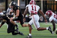 Vanderbilt quarterback Diego Pavia (2) runs the ball past Alabama linebacker Jihaad Campbell...