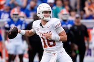 Texas quarterback Arch Manning (16) looks for a receiver during the first half of an NCAA...