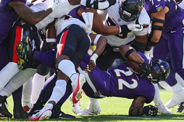 Derrick Henry #22 of the Baltimore Ravens is tackled as he rushes with the ball during the first quarter against the Houston Texans at M&T Bank Stadium on Oct. 05, 2025 in Baltimore, Maryland. (Photo by Patrick Smith/Getty Images)