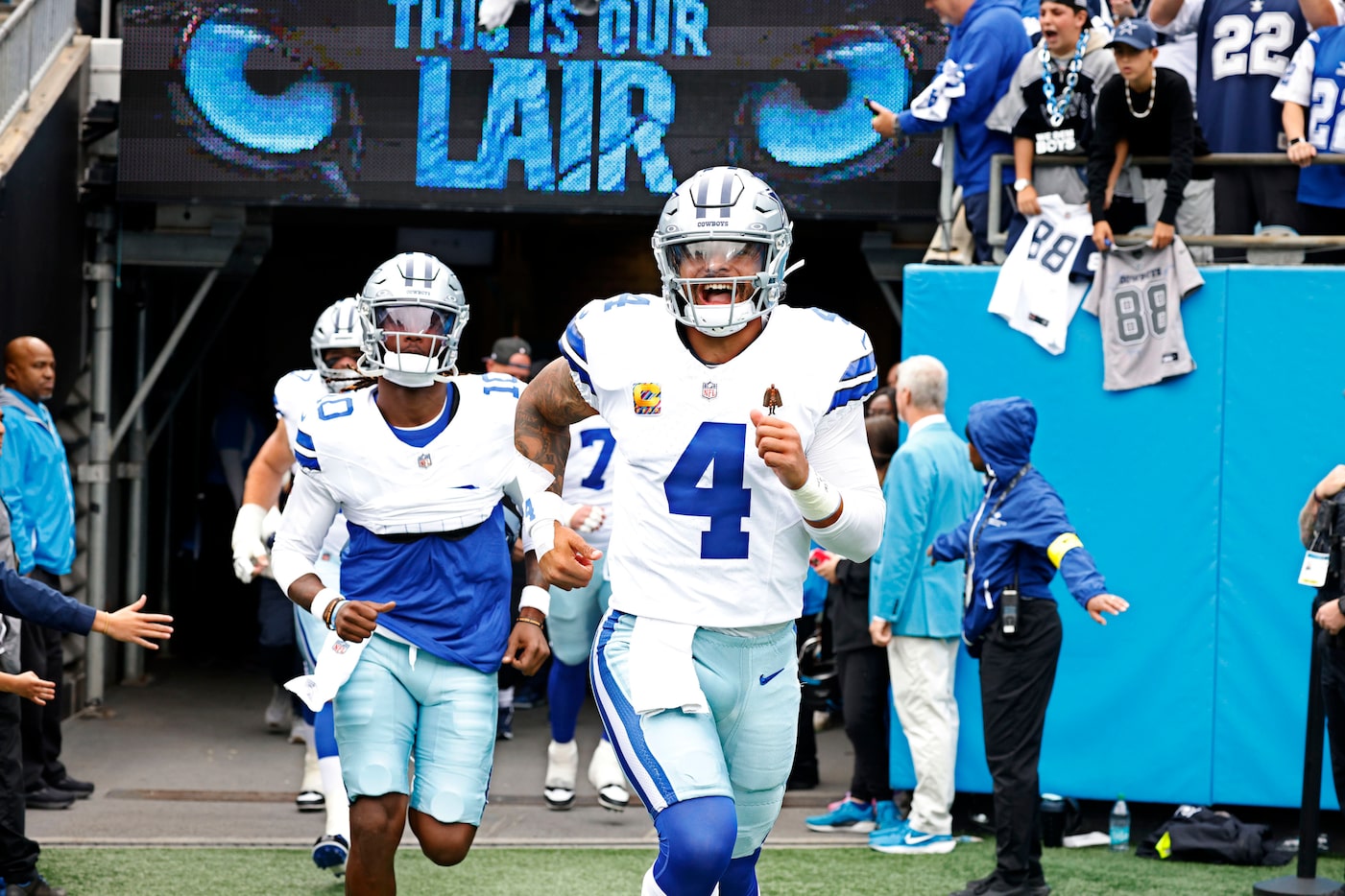 Dallas Cowboys quarterback Dak Prescott (4) and his teammates run onto the field before an...