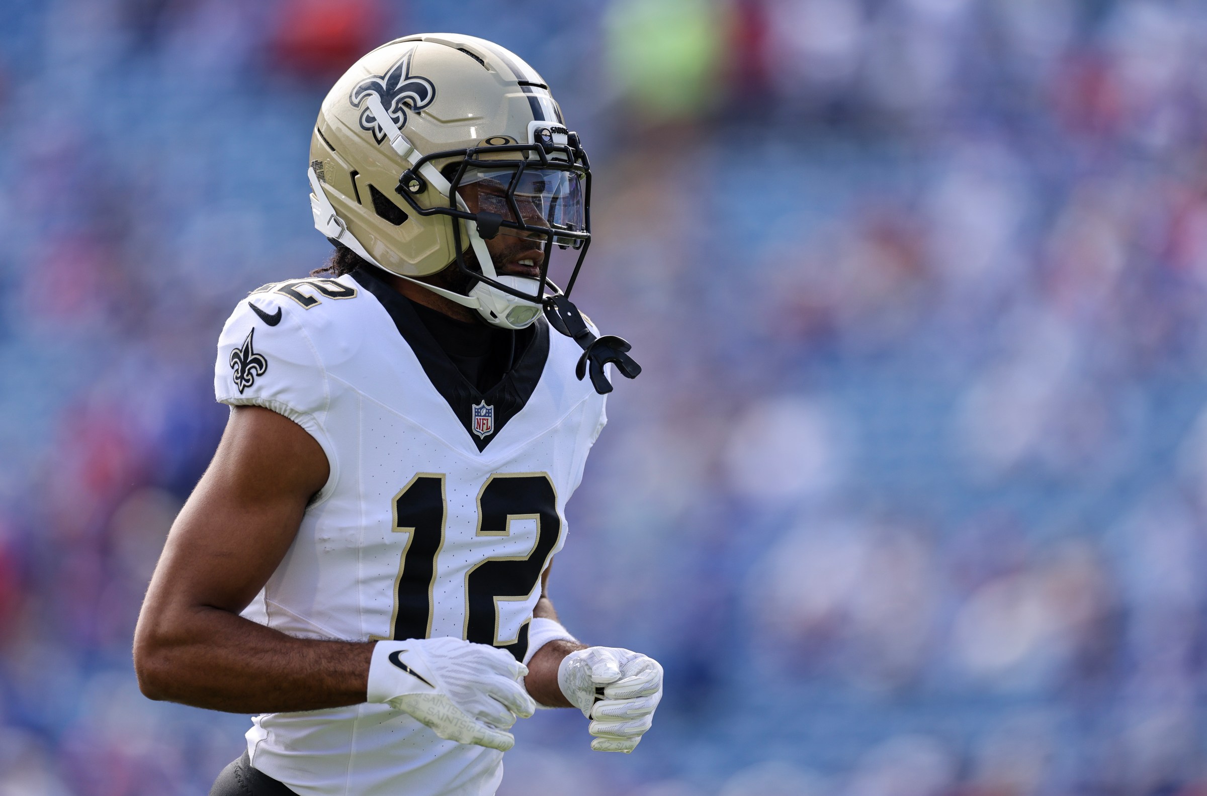 ORCHARD PARK, NEW YORK - SEPTEMBER 28: Chris Olave #12 of the New Orleans Saints looks on prior to the NFL 2025 game between New Orleans Saints and Buffalo Bills at Highmark Stadium on September 28, 2025 in Orchard Park, New York. (Photo by Bryan Bennett/Getty Images)