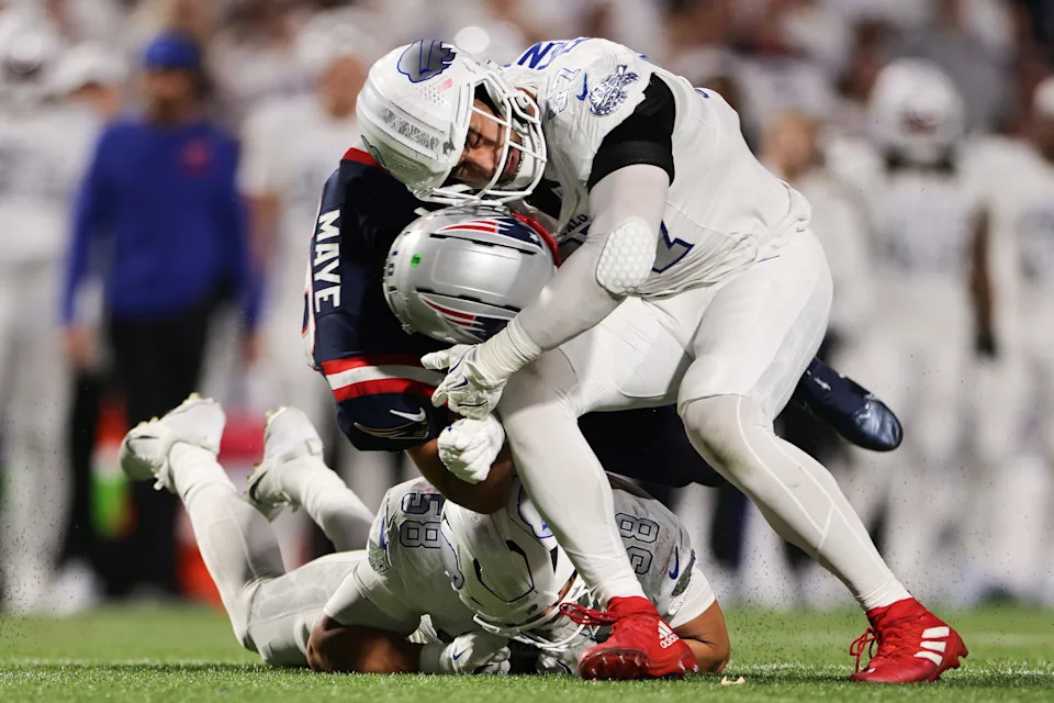 ORCHARD PARK, NEW YORK - OCTOBER 05: A.J. Epenesa #57 and Matt Milano #58 of the Buffalo Bills tackle Drake Maye #10 of the New England Patriots in the second quarter of the game at Highmark Stadium on October 05, 2025 in Orchard Park, New York. (Photo by Bryan M. Bennett/Getty Images)