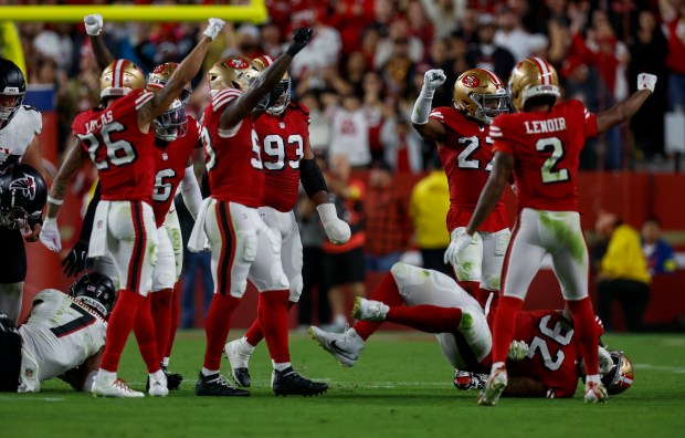 The San Francisco 49ers defense celebrates a fourth down stop against the Atlanta Falcons in the fourth quarter at Levi's Stadium in Santa Clara, Calif., on Sunday, Oct. 19, 2025. (Nhat V. Meyer/Bay Area News Group)