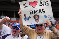 Fans cheer Dallas Cowboys running back Javonte Williams (33) before an NFL football game...
