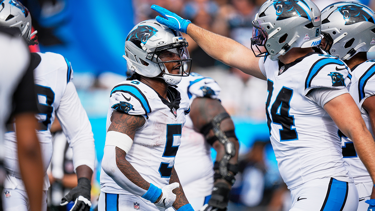 Panthers running back Rico Dowdle is congratulated by teammates after scoring Sunday against the Dolphins.