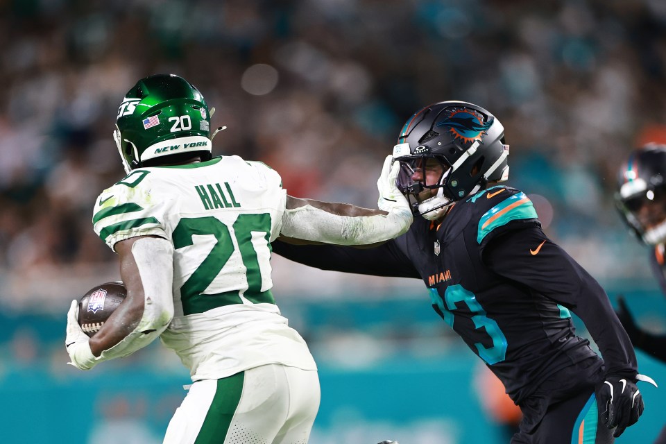 Breece Hall escapes a tackle with a stiff arm