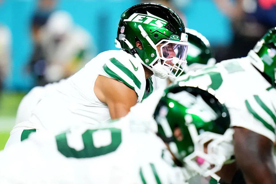 Sep 29, 2025; Miami Gardens, Florida, USA; New York Jets quarterback Justin Fields (7) takes the snap against the Miami Dolphins during the first half at Hard Rock Stadium. Mandatory Credit: Rich Storry-Imagn Images