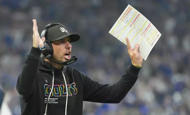 Indianapolis Colts head coach Shane Steichen signals a touchdown during the first half of an NFL football game against the Las Vegas Raiders, Sunday, Oct. 5, 2025, in Indianapolis. (AP Photo/AJ Mast)