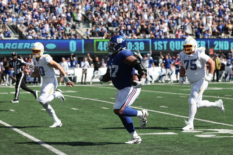 Dexter Lawrence intercepts a pass against the Chargers. Vincent Carchietta-Imagn Images
