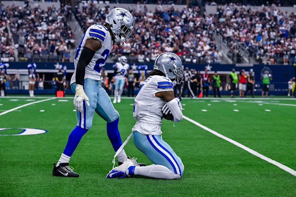Oct 2, 2022; Arlington, Texas, USA; Dallas Cowboys cornerback DaRon Bland (26) and cornerback Trevon Diggs (7) celebrate after Diggs intercepts a pass against the Washington Commanders during the game at AT&T Stadium. Mandatory Credit: Jerome Miron-USA TODAY Sports
