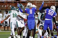 Duncanville defensive lineman Landon Barnes (8) just shrugs his shoulder after helping bring...