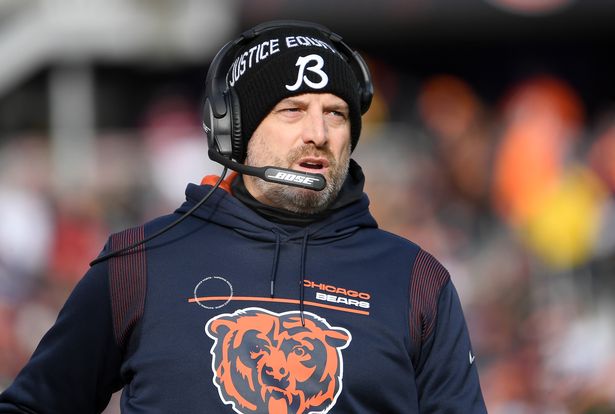 Matt Nagy wearing a Chicago Bears sweatshirt and headset while calling a play