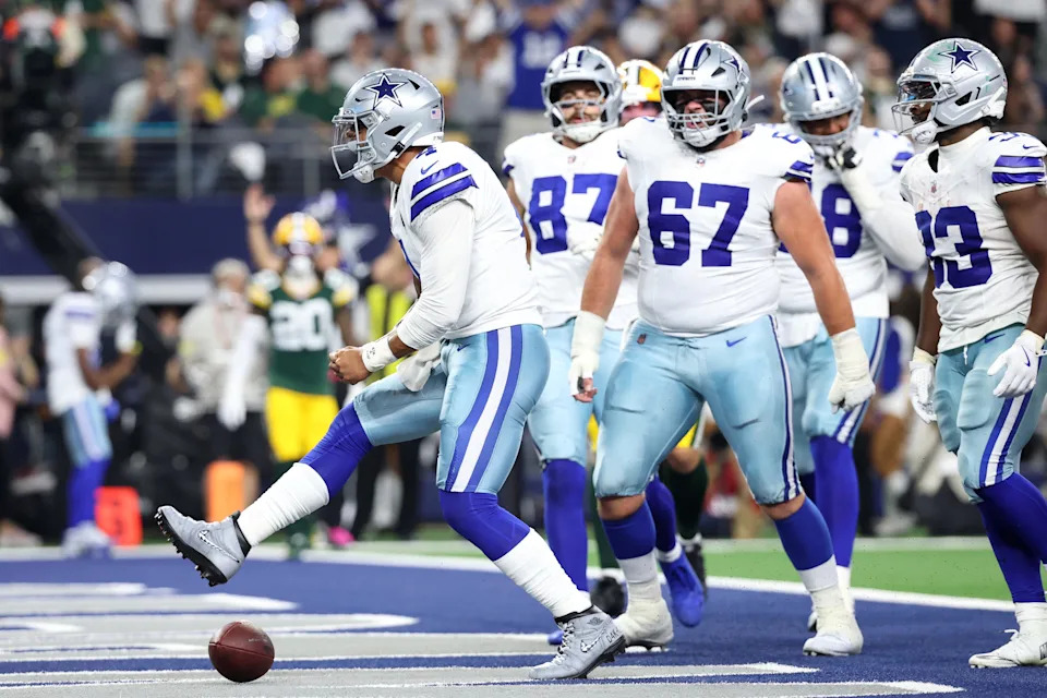 Sep 28, 2025; Arlington, Texas, USA; Dallas Cowboys quarterback Dak Prescott (4) celebrates after scoring a touchdown against the Green Bay Packers in the second quarter at AT&T Stadium. Mandatory Credit: Kevin Jairaj-Imagn Images