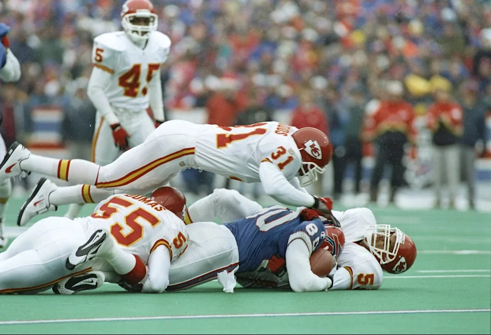 22 Dec 1996: Cornerback Jerome Woods and linebacker Donnie Edwards of the Kansas City Chiefs jumps at a fumble during a game against the Buffalo Bills at Rich Stadium in Orchard Park, New York. The Bills won the game 20-9. Mandatory Credit: Rick Stewart