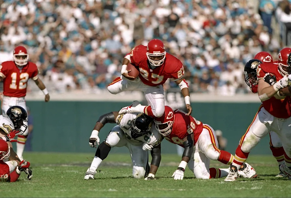 9 Nov 1997: Running back Greg Hill of the Kansas City Chiefs (top) jumps over Renaldo Wynn of the Jacksonville Jaguars during a game at Alltell Stadium in Jacksonville, Florida. The Jaguars won the game 24-10. Mandatory Credit: Andy Lyons /Allsport