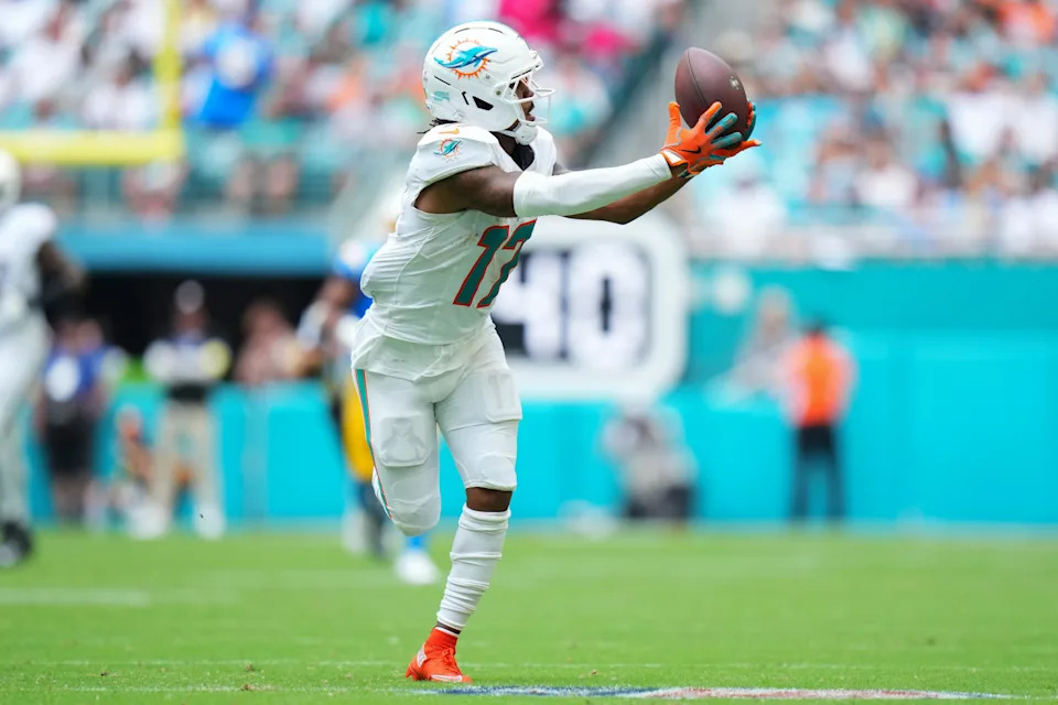 Oct 12, 2025; Miami Gardens, Florida, USA; Miami Dolphins wide receiver Jaylen Waddle (17) catches a pass against the Los Angeles Chargers during the second quarter at Hard Rock Stadium. Mandatory Credit: Rich Storry-Imagn Images