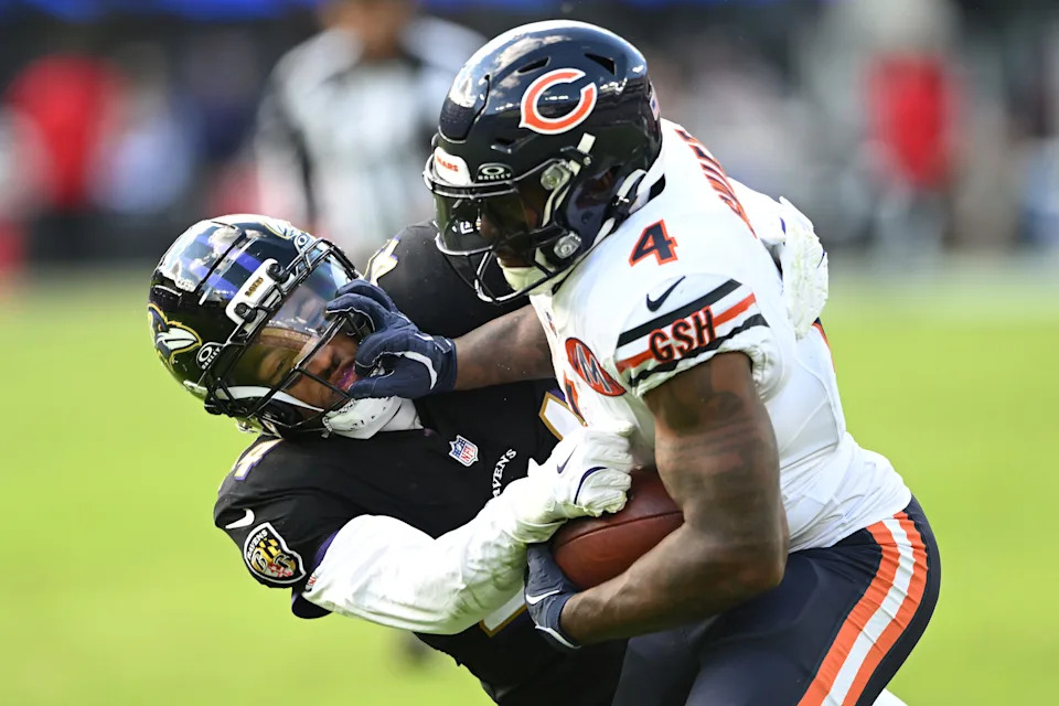 D'Andre Swift of the Chicago Bears is tackled by Marlon Humphrey.