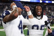 Dallas Cowboys quarterback Dak Prescott (4) laughs with wide receiver Ceedee Lamb (88)...