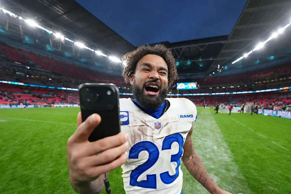 Los Angeles Rams running back Kyren Williams takes a video after their win against the Jacksonville Jaguars.