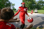 Kansas City Chiefs wide receiver Rashee Rice greets fans as he walks to the field at the...