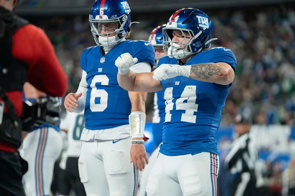 New York Giants running back Cam Skattebo (44) and New York Giants quarterback Jaxson Dart (6) celebrate after a touchdown during Thursday night’s win over the Eagles.