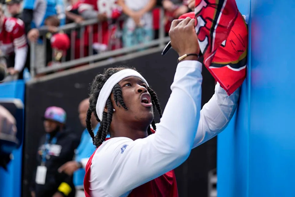 Ray-Ray McCloud III (3) signs a fan's shirt before the game against the Carolina PanthersJim Dedmon-Imagn Images
