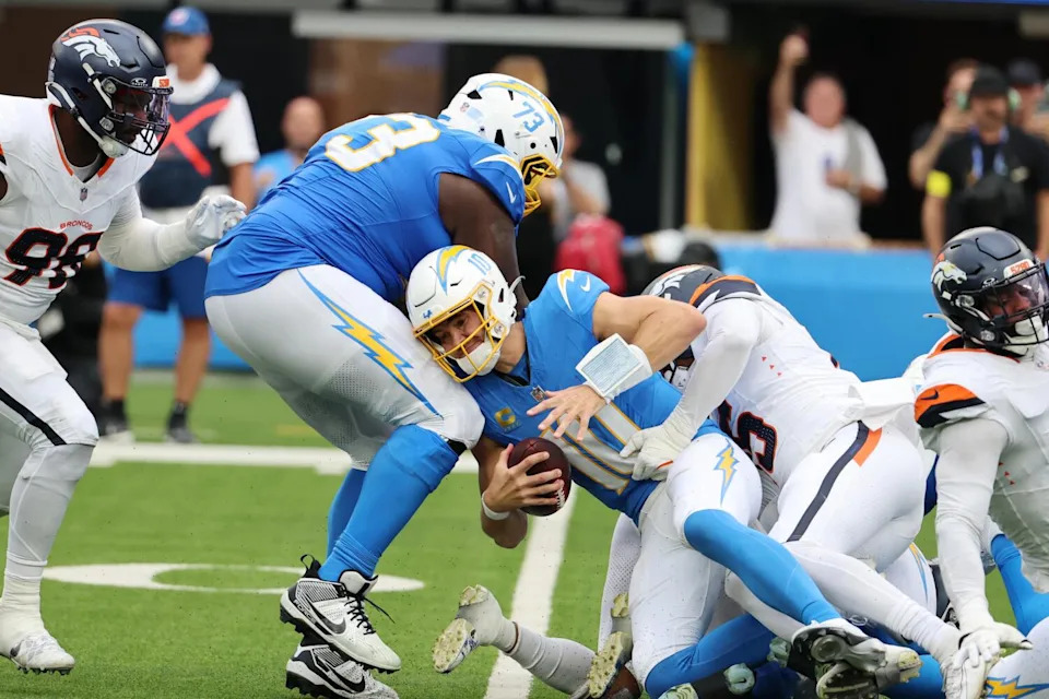 Chargers quarterback Justin Herbert is sacked during a win over the Denver Broncos on Sept. 21.