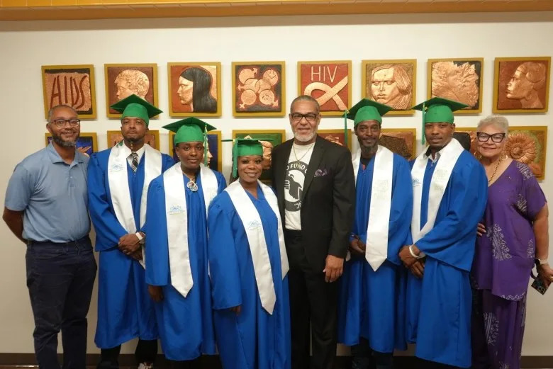 Some of the graduates, including Leon Dillard (far left) and Shanitra Sanford (middle) on graduation day. (Courtesy of the Black United Fund)
