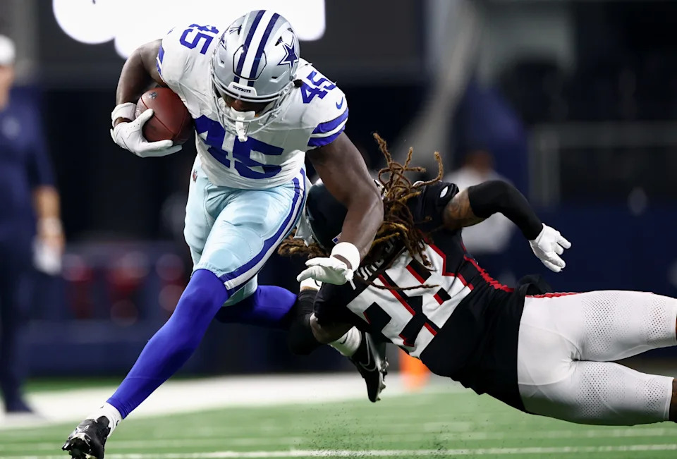 Aug 22, 2025; Arlington, Texas, USA; Dallas Cowboys tight end Rivaldo Fairweather (45) runs with the ball as Atlanta Falcons cornerback Mike Ford Jr. (28) defends during the second half at AT&T Stadium. Mandatory Credit: Kevin Jairaj-Imagn Images