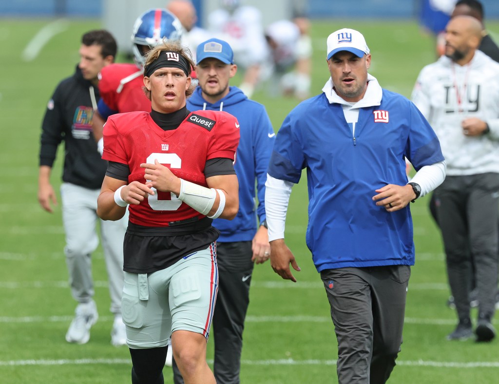 Jaxson Dart #6, and offensive coordinator Mike Kafka during practice at the New York Giants training facility in East Rutherford, New Jersey.
