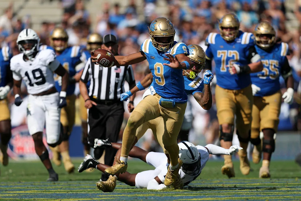 Oct 4, 2025; Pasadena, California, USA; UCLA Bruins quarterback Nico Iamaleava (9) runs with the ball during the third quarter against the Penn State Nittany Lions at Rose Bowl. Mandatory Credit: Kiyoshi Mio-Imagn Images