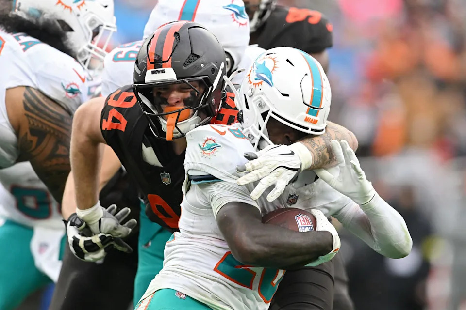 CLEVELAND, OHIO - OCTOBER 19: Mason Graham #94 of the Cleveland Browns tackles De'Von Achane #28 of the Miami Dolphins during the second half of the game at Huntington Bank Field on October 19, 2025 in Cleveland, Ohio. (Photo by Nick Cammett/Getty Images)
