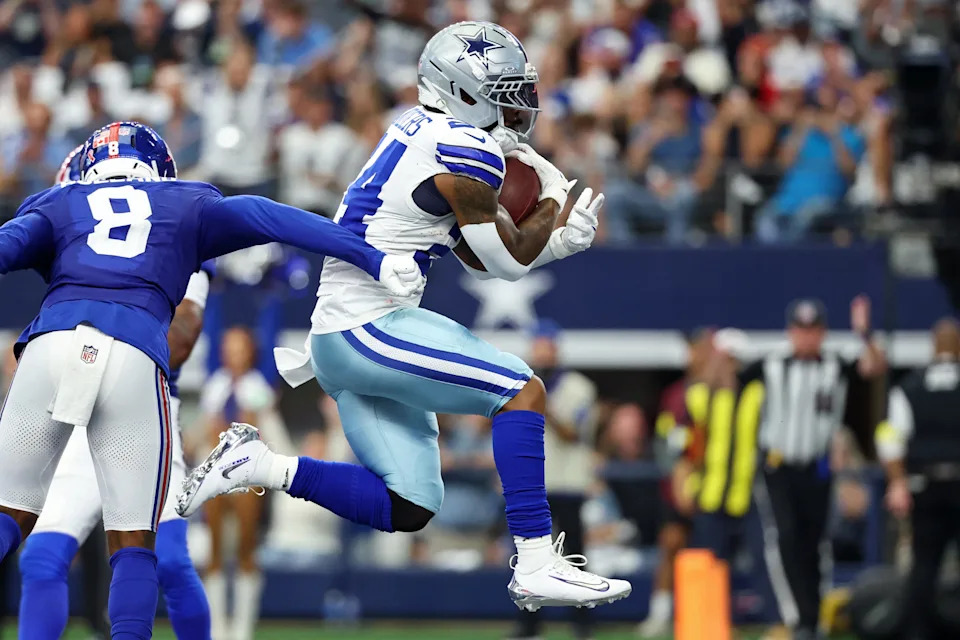 Sep 14, 2025; Arlington, Texas, USA; Dallas Cowboys running back Miles Sanders (24) scores a touchdown against the New York Giants during the fourth quarter at AT&T Stadium. Mandatory Credit: Kevin Jairaj-Imagn Images