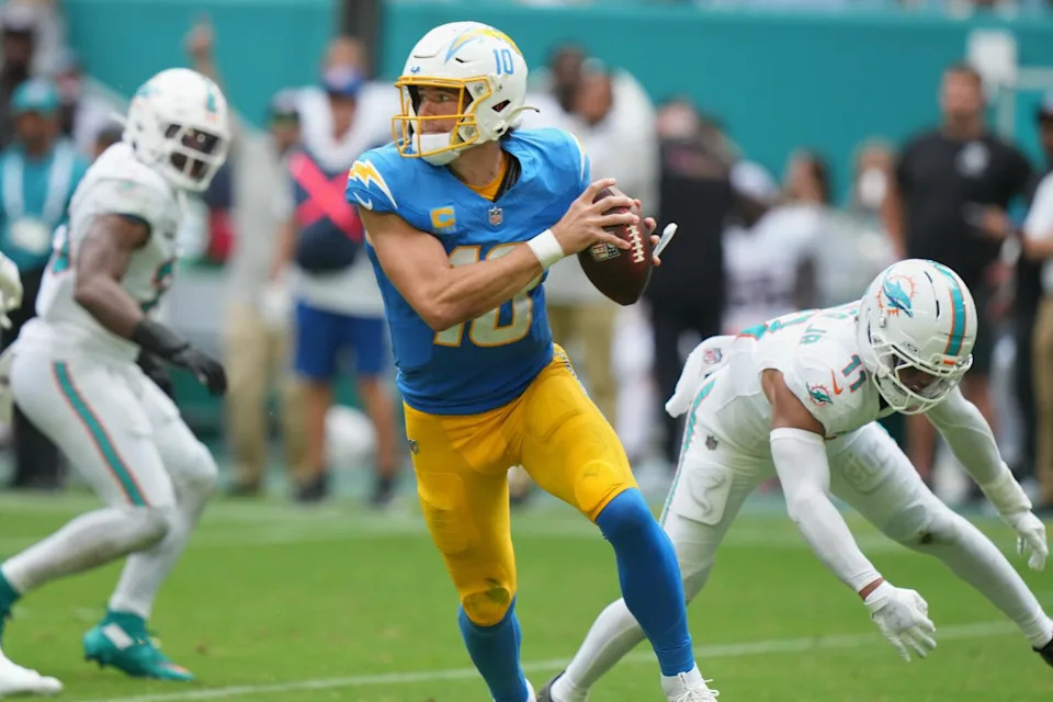 Chargers quarterback Justin Herbert scrambles during the second half against the Dolphins.