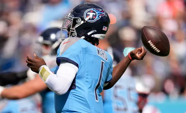 Tennessee Titans quarterback Cam Ward (1) fumbles during the second half of an NFL football game against the New England Patriots, Sunday, Oct. 19, 2025, in Nashville, Tenn. (AP Photo/George Walker IV)