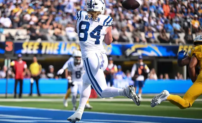 Indianapolis Colts tight end Tyler Warren (84) makes a catch for a touchdown against the Los Angeles Chargers during the first half of an NFL football game Sunday, Oct. 19, 2025, in Inglewood, Calif. (AP Photo/Carrie Giordano)