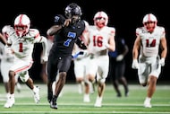 North Forney quarterback Legend Bey (7) breaks through the Rockwall-Heath defense on a 63...
